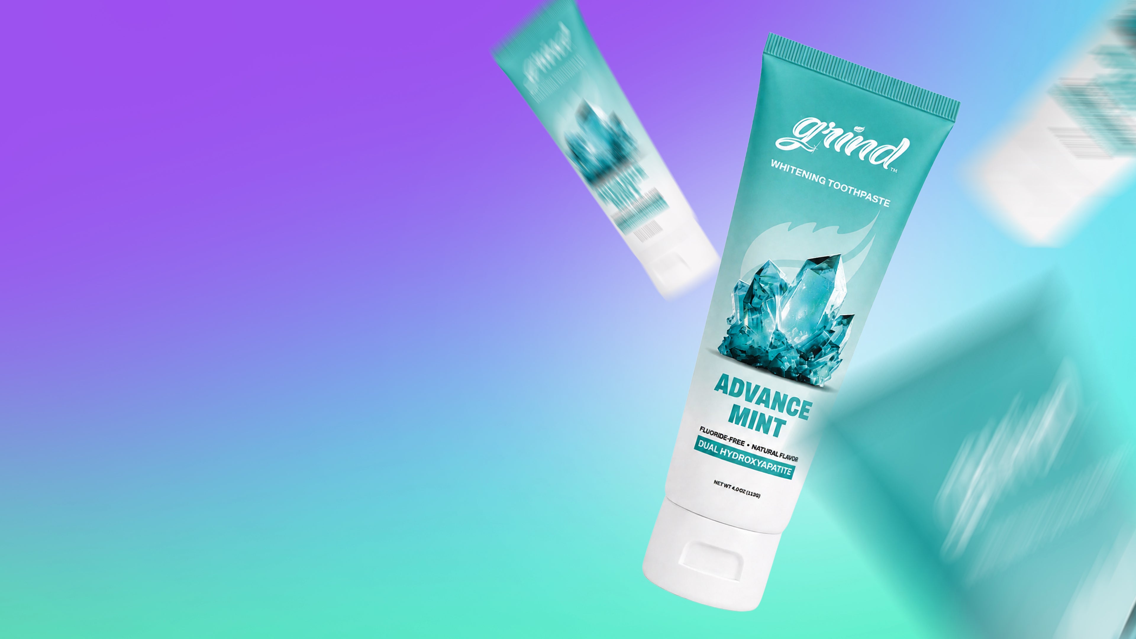 Grind Advance Mint whitening toothpaste tube on a purple and mint gradient
